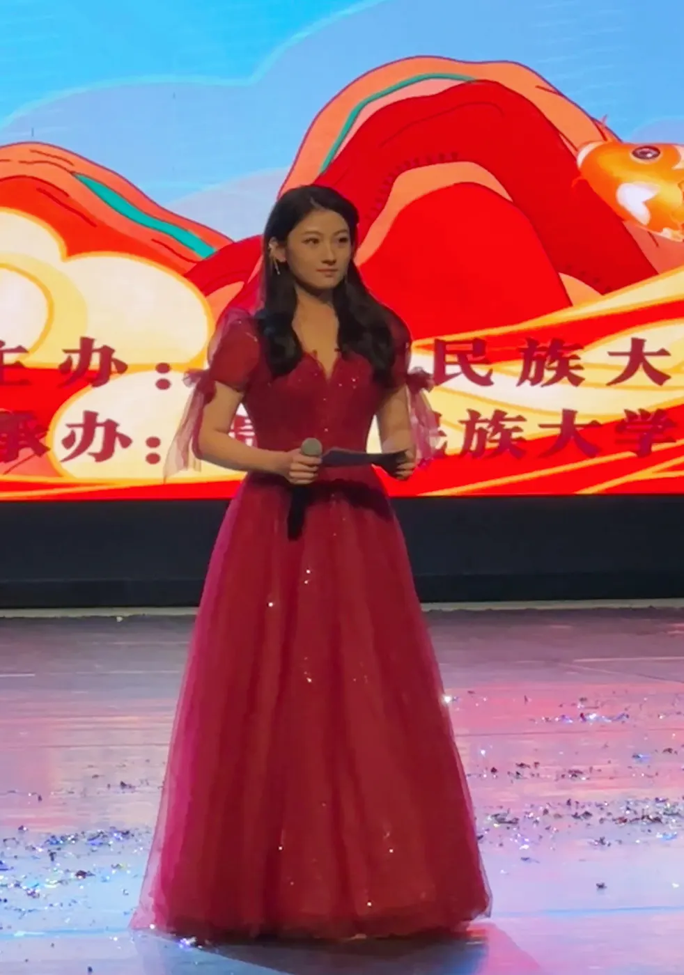Huiyao Zhou speaking on stage