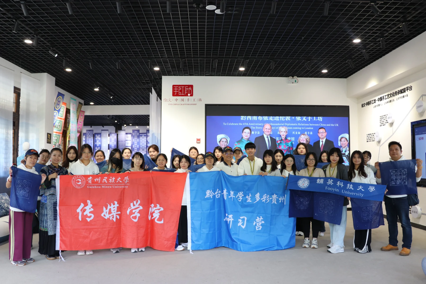 Camp participants posing together during an indoor visit